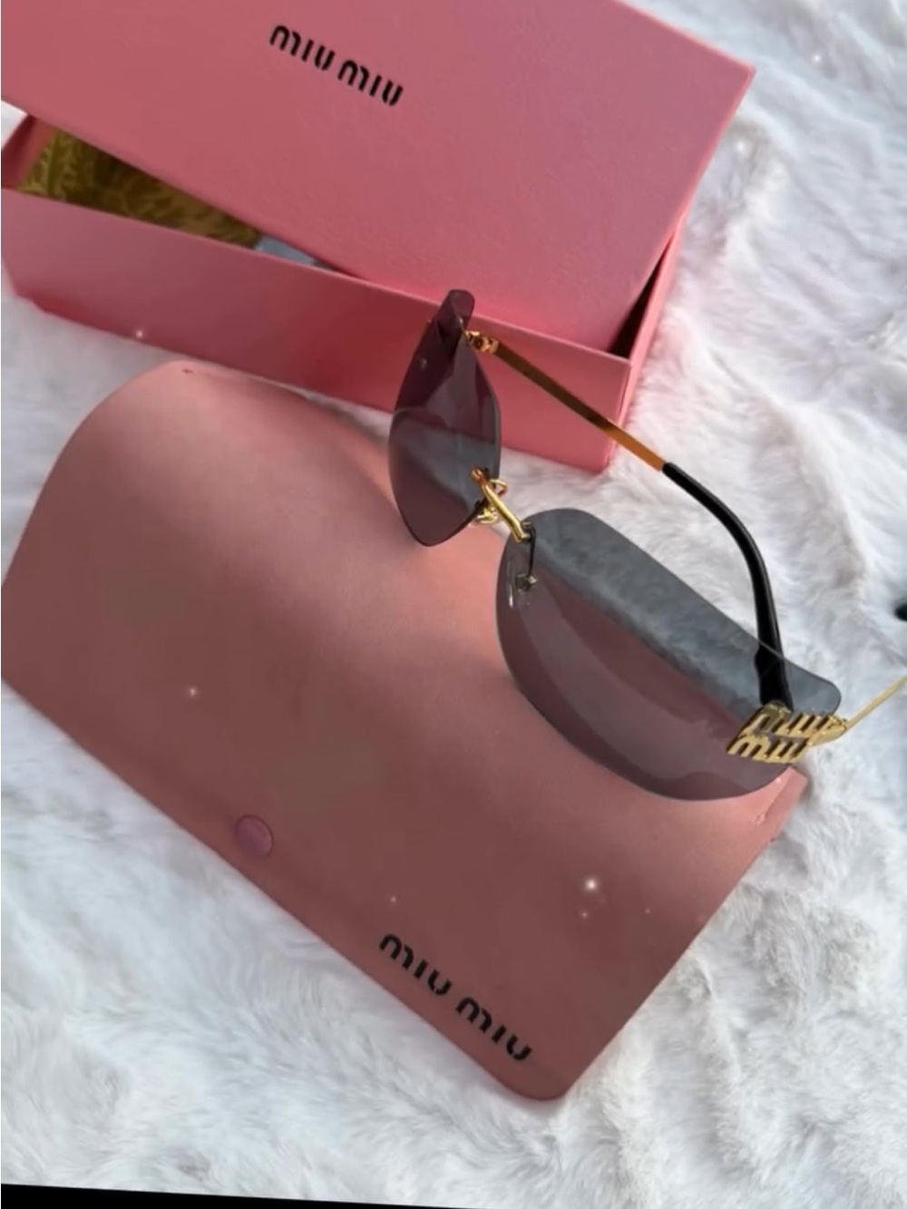 Miu Miu Rimless Sunglasses with Gray Lenses and Gold Temples